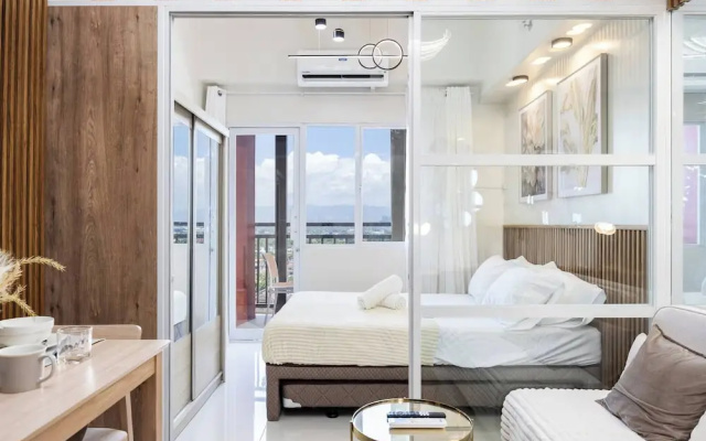 Elegant Wood-accent Studio With Balcony