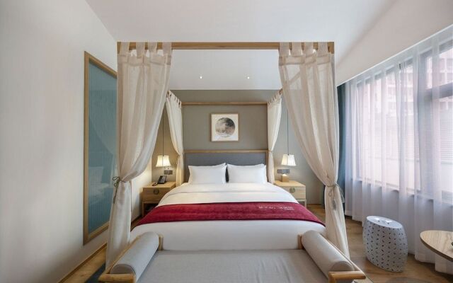 Qianna Hotel (Zhengzhou Erqi Square David City)