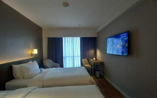 Capital O 950 Acqua Novotel Tower