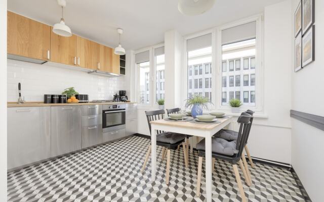 Grey Apartment Śródmieście by Renters