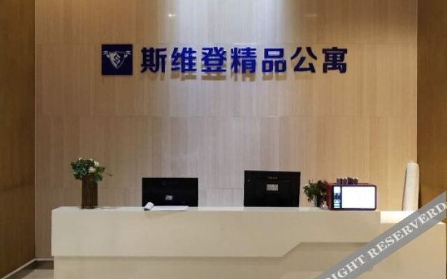 Xinyueju Boutique Apartment (Shishi Clothing City Shimao Skyscraper City Branch)