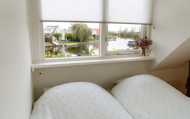 Nice Holiday Home on the Water in Grou