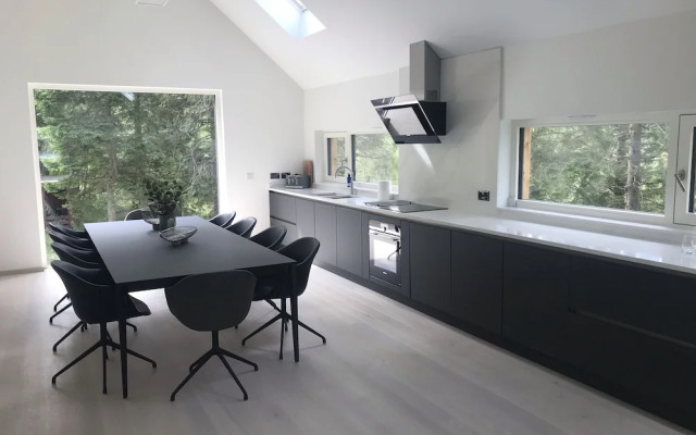 An Caisteal Lodge With Cascading Waterfall View