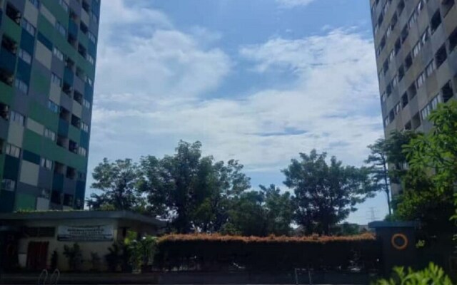 THE ROOMOS Hotel Apartemen