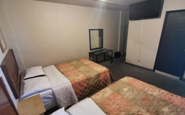 Capital O Baja Place Inn