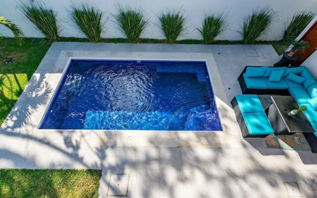 Ultramodern Townhome with an Inviting Coastal Design and Lush Outdoor Oasis with a Private Pool