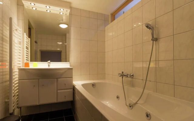 Cozy decorated house with fireplace, surrounded by forest