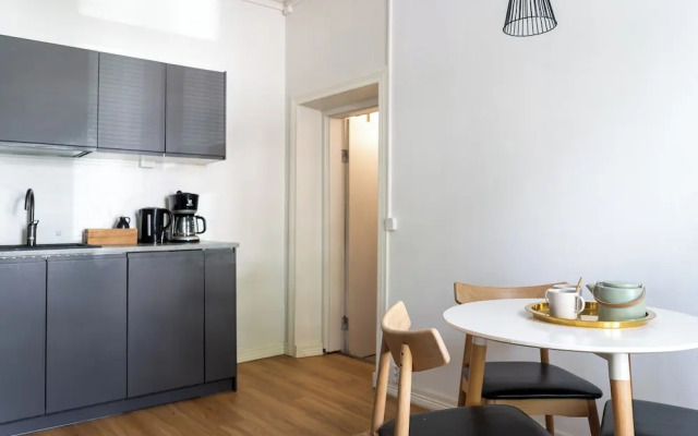 A bright wooden studio for four