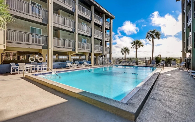 Newly Remodeled Oceanfront Condo with Salt Water Pool and Private Walkway to Beach by RedAwning