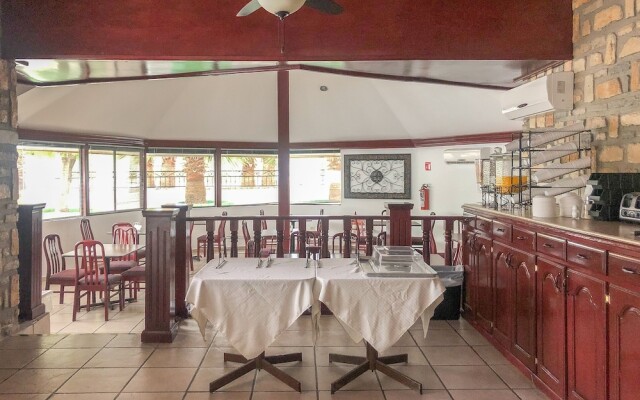 Capital O Palms Hotel