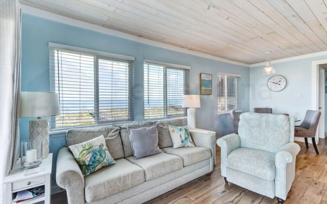 Newly Remodeled Oceanfront Condo with Salt Water Pool and Private Walkway to Beach by RedAwning