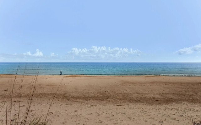 Roomy Chalet-Style Beachfront Condo with Private Beach Access by RedAwning