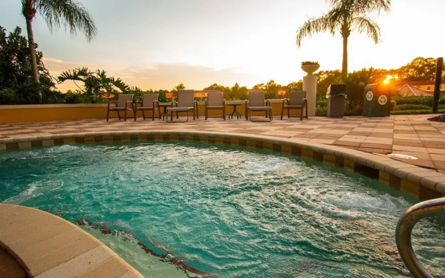 Private Screened Splash Pool Overlooking Tranquil Lake Right Beside Disney World by Florida Dream Homes