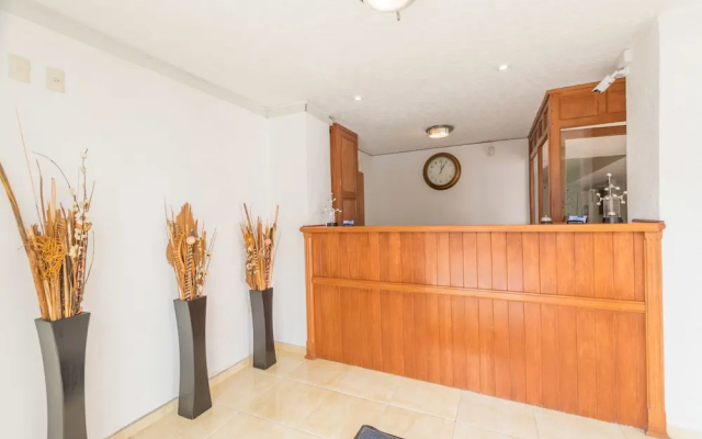 Suites Poliforum Inn