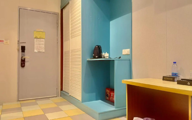 Q+ Nanxiong Xinhewan Business Hotel