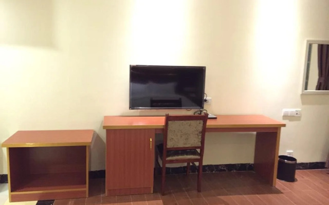 Q+ Nanxiong Xinhewan Business Hotel