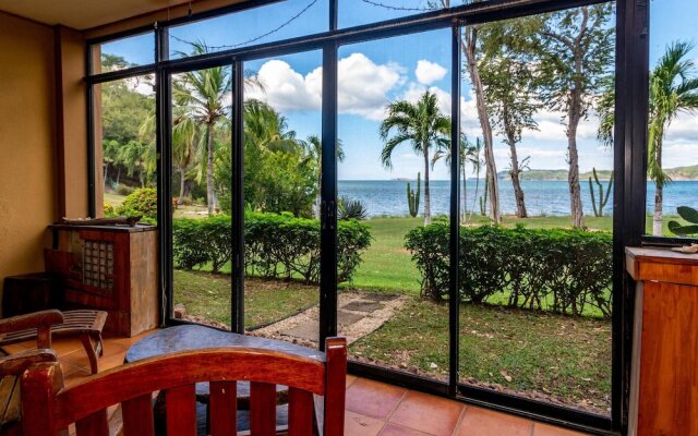 Warm Interiors and Orange Hues on Ground Floor in Front of Beach