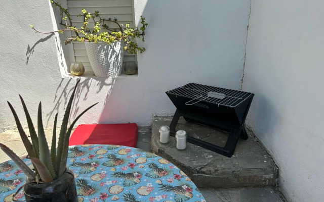 Mediterranean poolside garden cottage