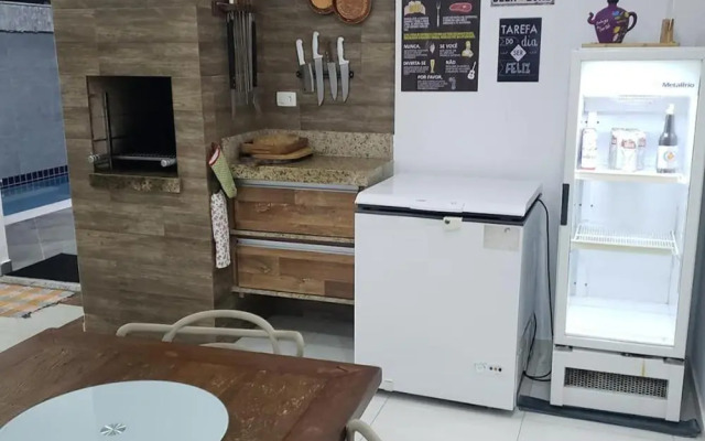 Casa com piscina e churrasqueira em Massaguaçu SP