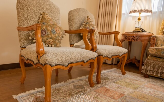 The Grand Palace Suites & Hotel