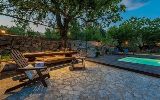 Stone house M&A with pool