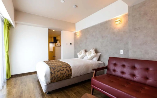 Mr.KINJO in front of Manza Beach