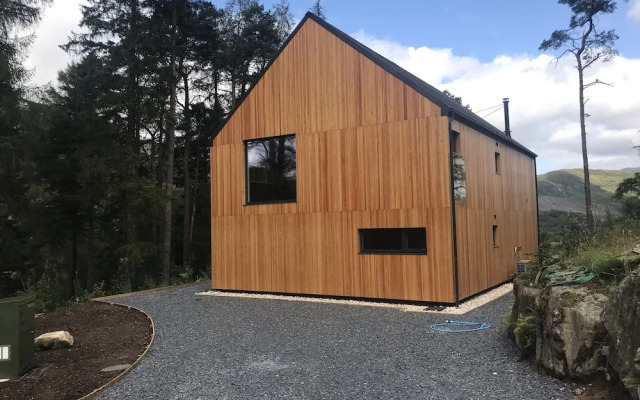 Red Stag With Stunning Loch and Waterfall View