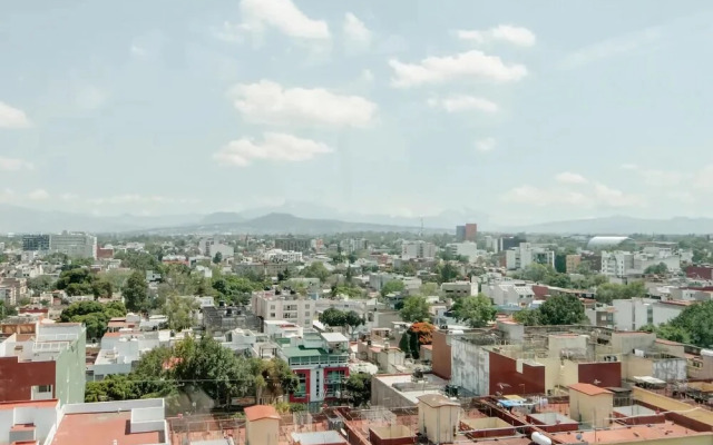Bed in mixed room near Coyoacan