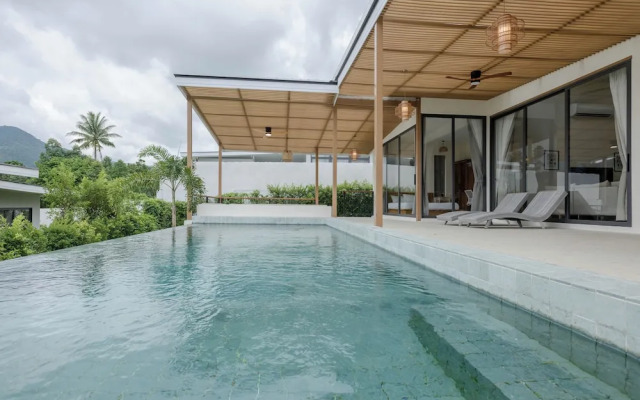 Tropical Poolside Retreat by Sea N' Rent