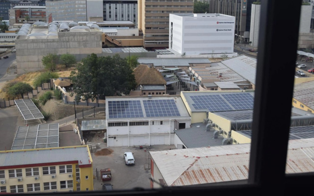 Highrise Windhoek apartment with skyline view, pool and gym