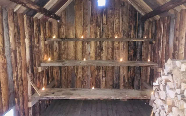 Tiny hut in the Forest Overlooking the River