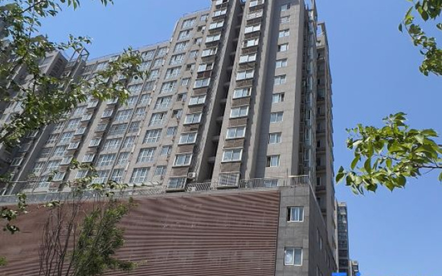 Tongbaiyun Hotel (Suqian Hongzehu East Road Sunshine 100 Shop)