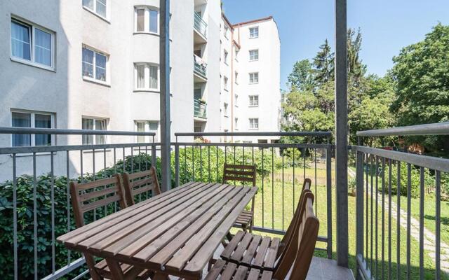 Colorful Apartment Facing Green Courtyard