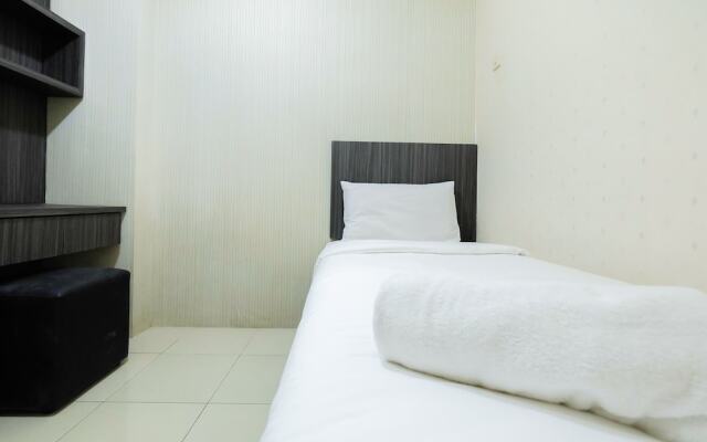 Monochrome Style 2 Bedrooms at Kalibata City Apartment By Travelio
