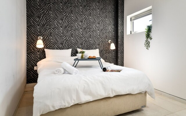 Modern Gem with Stunning Balcony by Sea N Rent