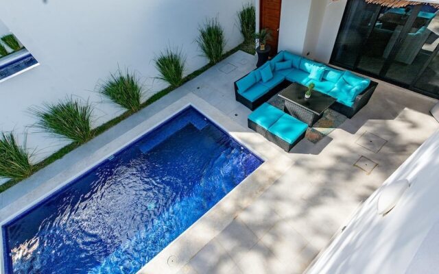 Ultramodern Townhome with an Inviting Coastal Design and Lush Outdoor Oasis with a Private Pool