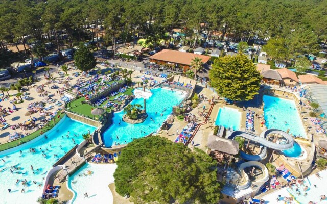 Cozy Mobile Home With Covered Terrace on a Luxury Campsite