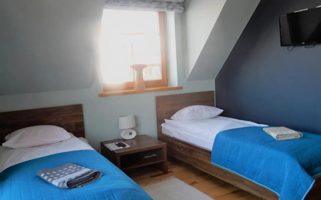 Domek za Strugiem - pokoje i apartamenty
