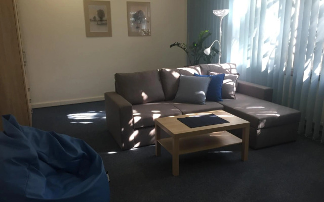 Blue apartment in beautiful English style garden with atmosphere