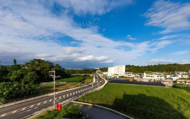 Mr.KINJO in front of Manza Beach