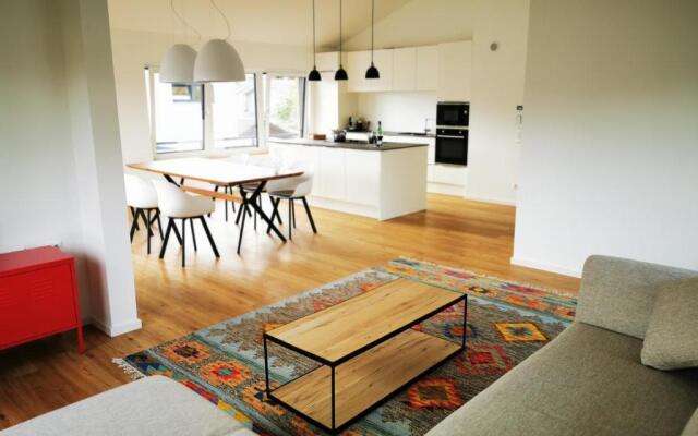 Chalethaus-Chiemsee - 120qm Panorama-Chaletwohnung am Chiemsee - Neubau