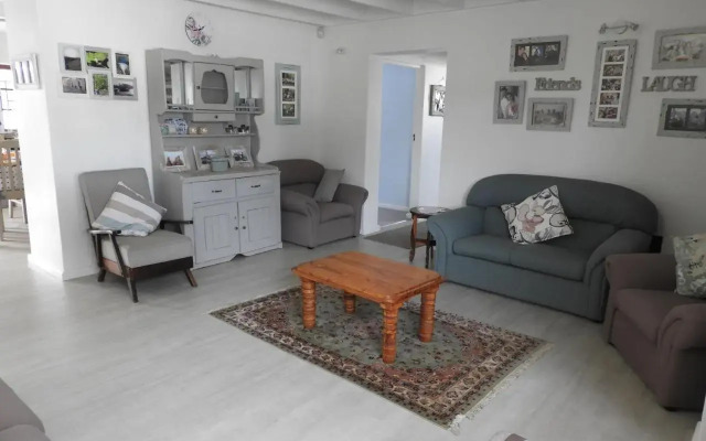 Cozy 4 bedroom house enclosed by sea and mountain.