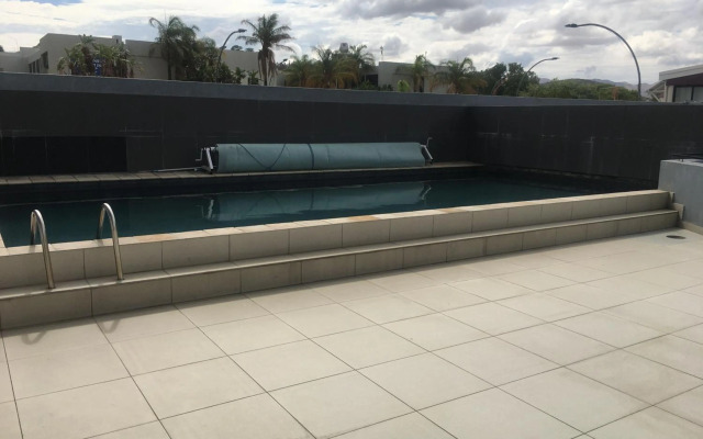 Highrise Windhoek apartment with skyline view, pool and gym