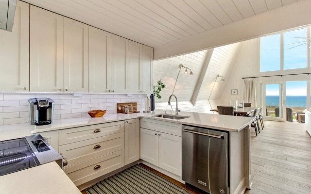 Roomy Chalet-Style Beachfront Condo with Private Beach Access by RedAwning