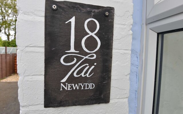 18 Tai Newydd