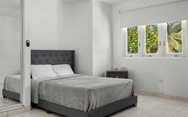 Beach Access Escape With Pool and Tanning Lounges