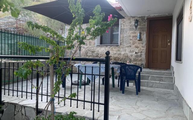 Stone house under a rock Kukos