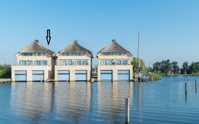 Exclusive Holiday Home Floating on a Lake in Friesland