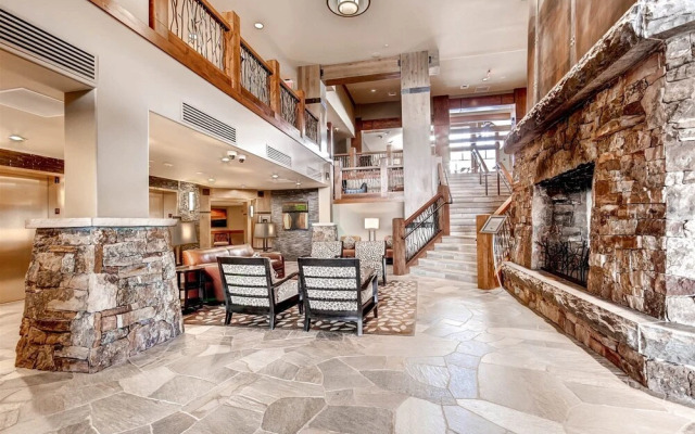 Expansive 4 Bedroom Ski in, Ski out One Ski Hill Residence Located at the Base of Peak 8 with Beautiful Views