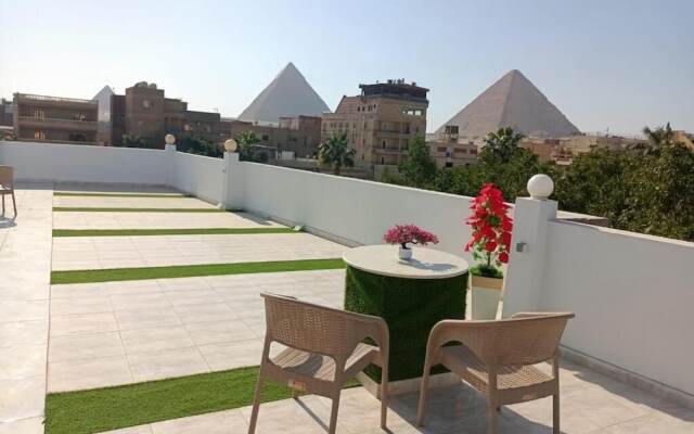 Nefertiti Pyramids View